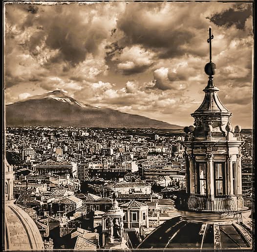 THE TOWN AND MOUNT ETNA IN THE DISTANCE