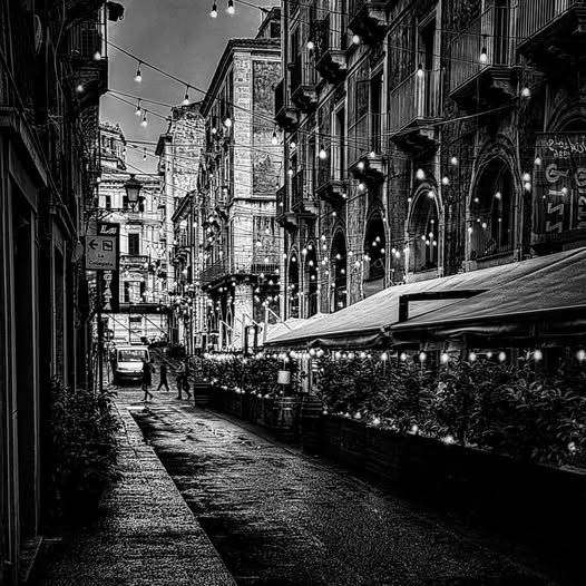 DOWNTOWN LIGHTS UNDER THE RAIN